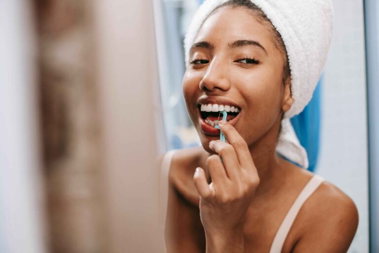 Close-up of teeth before and after professional whitening.